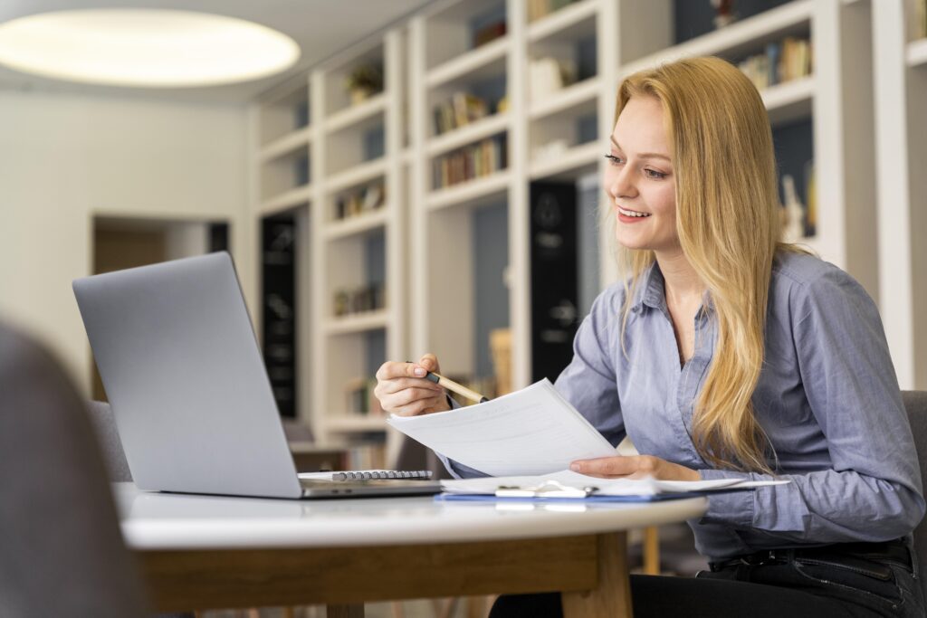 medium shot woman holding paper